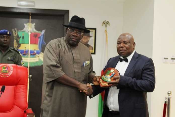 Bayelsa State Governor, Hon. Seriake Dickson (left) presenting a souvenir to the Acting Managing Director/Chief Executive Officer of NDDC, Prof. Nelson Brambaifa (right) during a courtesy call at Government House, Yenagoa